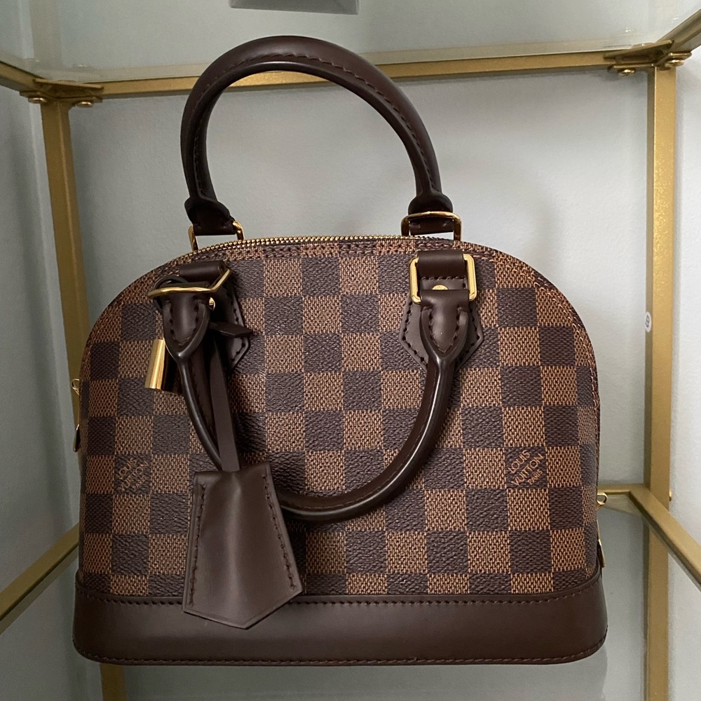 Authentic Louis Vuitton Bag 
Damier Ebene Alma